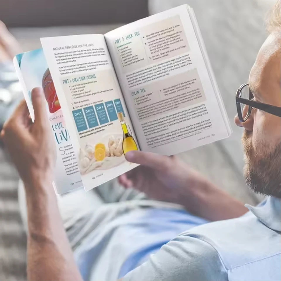 Man reading a book with a focus on health or nutrition.